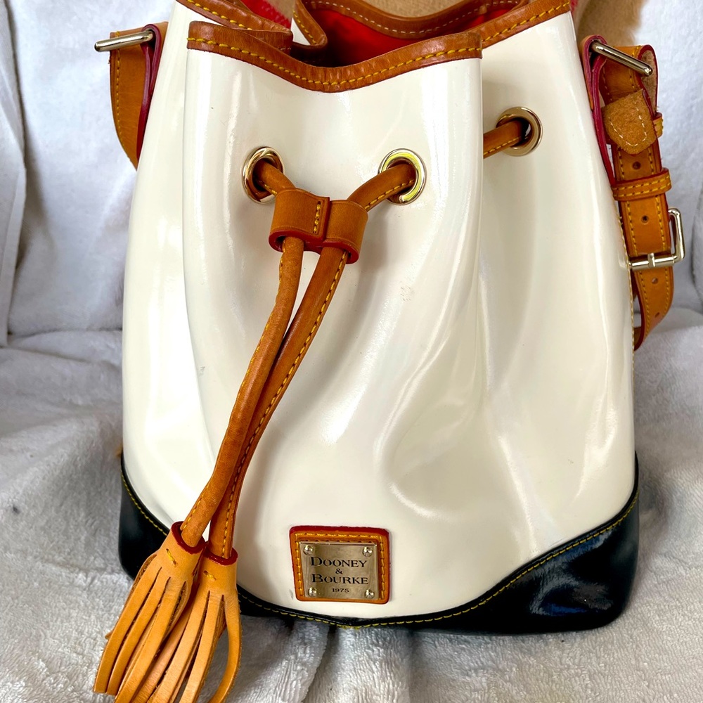 Dooney & Bourke leather bucket satchel bag cream & black, red interior